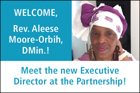 Text in white reads, "WELCOME, Rev. Aleese Moore-Orbih, DMin.!" To the right is a photo of Dr. Moore-Orbih, a Black woman, wearing a purple and white African Head Wrap. "Meet the new Executive Director at the Partnership" is shown at the bottom in blue.